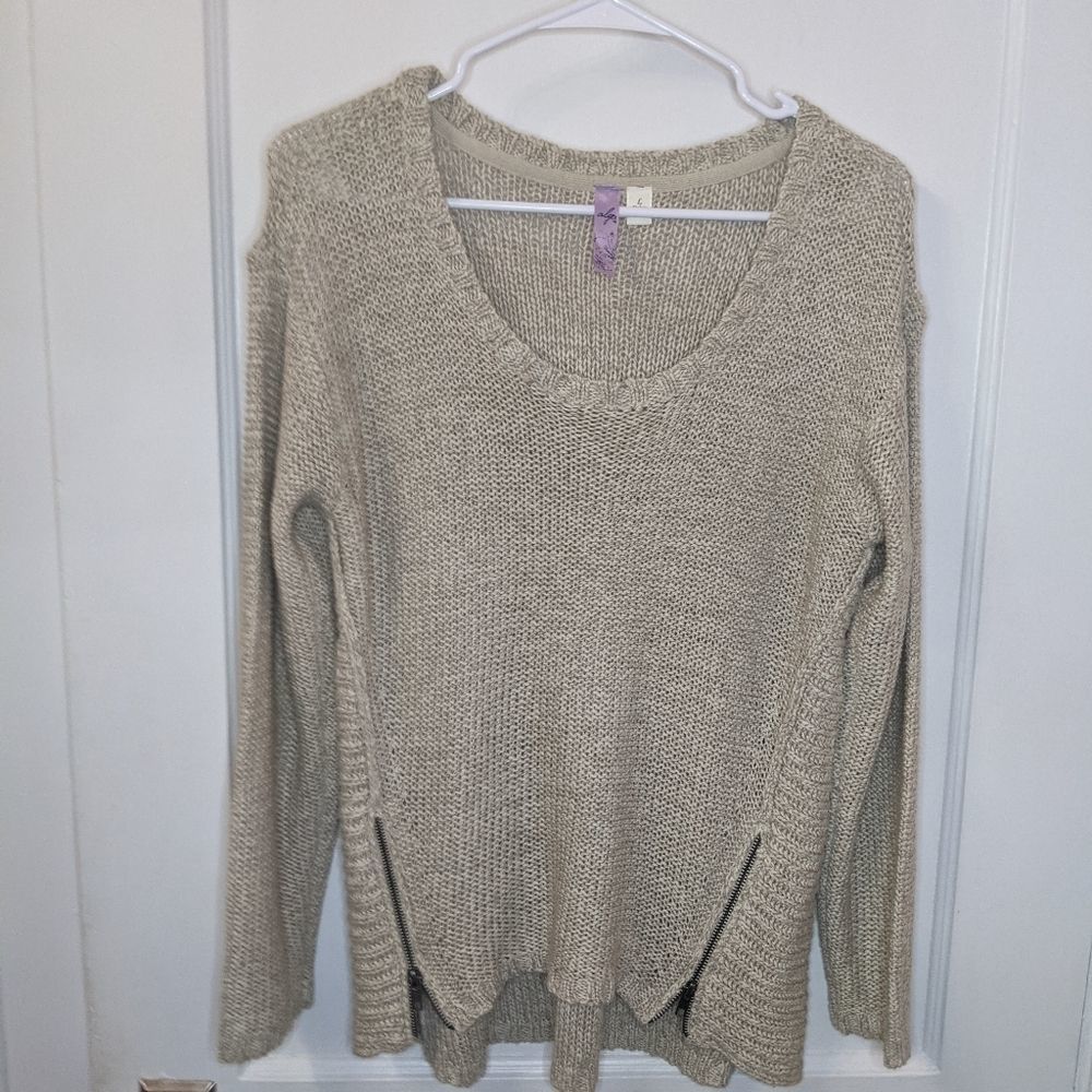 Alya cream sweater with zippers on bottom